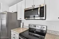 3834 Lady Bug Drive, Shallotte, NC 28470 — 2-bedroom home in Wildwood Village, Shallotte, NC, photo 9 of 19: Kitchen