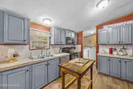 1221 Arvida Spur Road, Rocky Point, NC 28457 — 4-bedroom manufactured home in Arvida Lands, Rocky Point, NC, photo 20 of 44: 23_kitchen