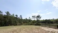 517 Belfort Lane SW 77, Ocean Isle Beach, NC 28469 — 4-bedroom home in Glendale Arbor, Ocean Isle Beach, NC, photo 3 of 34: Lot 77 Back