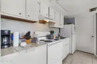 454 Racine Drive E106 A & B, Wilmington, NC 28403 — 2-bedroom condo in Campus Edge, Wilmington, NC, photo 11 of 25: Kitchen (2)