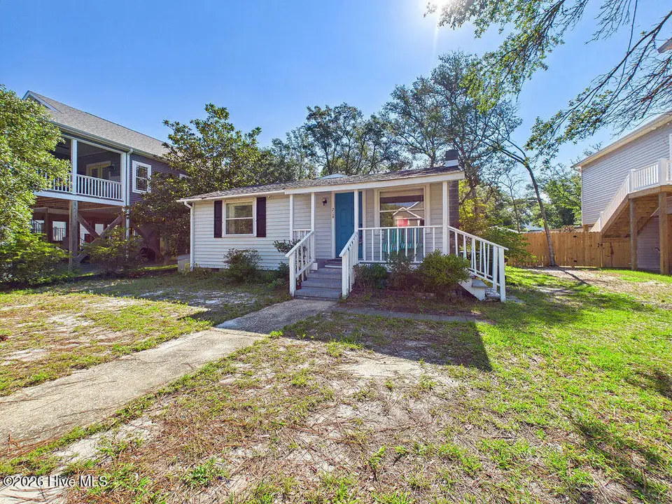 214 NE 64th Street, Oak Island, NC 28465 — 3-bedroom home in Tranquil Harbor, Oak Island, NC, photo 1 of 46