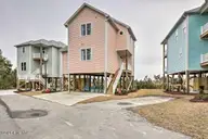 124 Salt Marsh Way, Atlantic Beach, NC 28512 — 4-bedroom waterfront home in Salt Marsh Villas, Atlantic Beach, NC, photo 1 of 32: Pink26