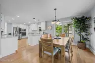 904 Coral Court, New Bern, NC 28560 — 4-bedroom waterfront home in Fairfield Harbour, New Bern, NC, photo 14 of 64: Dining between kitche and living room