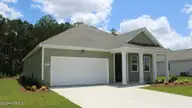 1307 Woodhouse Drive NW, Ash, NC 28420 — 3-bedroom home in Brunswick Plantation, Ash, NC, photo 2 of 23: Aria_H_Side