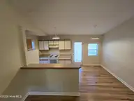 502 Wesley Avenue, Wilmington, NC 28403 — 3-bedroom home in Hillsdale, Wilmington, NC, photo 7 of 37: Living room to kitchen (2)