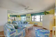 1505 Salter Path Road 435, Indian Beach, NC 28512 — 3-bedroom waterfront condo in Summer Winds Condominiums, Indian Beach, NC, photo 13 of 28: Living Room with Mirror Wall