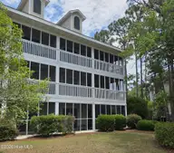 3350 Club Villas Drive # 405, Southport, NC 28461 — 2-bedroom condo in St James, Southport, NC, photo 3 of 39: Back of condo