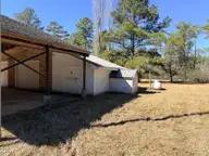 19 Wilkins Road, Belhaven, NC 27810 — 4-bedroom home, Belhaven, NC, photo 12 of 61: 12 View of car port and side of garage