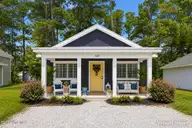 122 Long Pond Loop, Swansboro, NC 28584 — 2-bedroom waterfront condo in Cabins at Old Horse, Swansboro, NC, photo 1 of 22: Exterior Front Virtually Staged