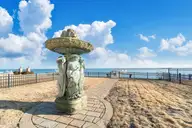 205 Back Street, Newport, NC 28570 — 4-bedroom waterfront home in Cannonsgate, Newport, NC, photo 20 of 52: Statue on lower level fenced
