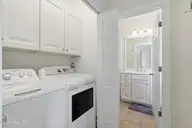 105 Winston Avenue Unit A, Atlantic Beach, NC 28512 — 2-bedroom condo in Triple Ess Shores, Atlantic Beach, NC, photo 7 of 37: Laundry Closet 1st Floor