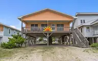 210 W Beach Drive, Oak Island, NC 28465 — 4-bedroom waterfront home, Oak Island, NC, photo 1 of 42: Screenshot 2025-06-17 120332