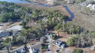117 Halls Creek Drive, Swansboro, NC 28584 — 4-bedroom waterfront home in Halls Creek At The Hammocks, Swansboro, NC, photo 3 of 38: drone property pic