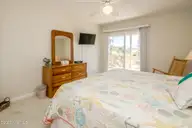 1131 S Shore Drive, Surf City, NC 28445 — 4-bedroom waterfront home in Horse Hammock, Surf City, NC, photo 19 of 40: Streetside South King Bedroom II