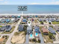 2003 W Pelican Drive, Oak Island, NC 28465 — 4-bedroom waterfront home in W. Long Beach, Oak Island, NC, photo 3 of 65: Steps to beach access!