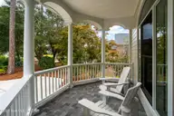 3705 Fairfield Way, Southport, NC 28461 — 4-bedroom waterfront home in St James, Southport, NC, photo 12 of 74: Rocking Chair Front Porch