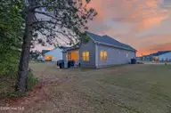 1720 Dew Meadow Drive, Winterville, NC 28590 — 3-bedroom home in Langston Farms, Winterville, NC, photo 10 of 60: 003_DSC_8299#twilight