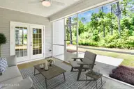 1034 Paddington Avenue NE, Leland, NC 28451 — 5-bedroom home in Parkwood Estates, Leland, NC, photo 14 of 23: 13 screened porch