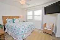 2909 Pointe West Drive 3b1, Emerald Isle, NC 28594 — 2-bedroom waterfront condo in Pier Pointe, Emerald Isle, NC, photo 15 of 34: Primary Bedroom Suite