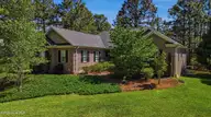 103 Smathers Drive, West End, NC 27376 — 4-bedroom waterfront home in Seven Lakes West, West End, NC, photo 2 of 51: DJI_20260603105055_0812_D