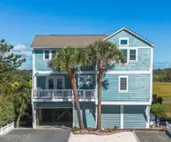 648 Ocean Boulevard W, Holden Beach, NC 28462 — 3-bedroom waterfront home in Bacon Island Harbor, Holden Beach, NC, photo 1 of 65: Front 1