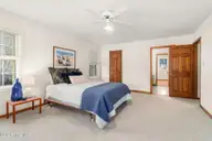175 Cedar Lane, Newport, NC 28570 — 3-bedroom home in Gull Harbor, Newport, NC, photo 9 of 30: primary bedroom 1 to bath