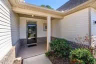 2050 Lindrick Court NW, Calabash, NC 28467 — 3-bedroom home in Spring Mill, Calabash, NC, photo 3 of 32: 36-web-or-mls-25 front porch