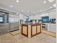 1505 Salter Path Road M, Indian Beach, NC 28512 — 4-bedroom waterfront condo in Summer Winds Condominiums, Indian Beach, NC, photo 6 of 68: Kitchen and Island