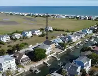 147 Swordfish Drive, Holden Beach, NC 28462 — 5-bedroom waterfront home, Holden Beach, NC, photo 10 of 12: rear canal view