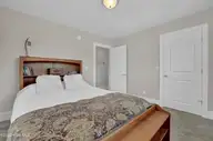 134 Wild Berry Lane, Hampstead, NC 28443 — 5-bedroom waterfront home in Bent Tree, Hampstead, NC, photo 21 of 46: Bedroom