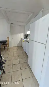 456 Racine Drive Unit D304, Wilmington, NC 28403 — 2-bedroom condo in Campus Edge, Wilmington, NC, photo 11 of 13: Shared Kitchen