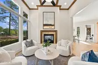 70 Royal Dublin Downs, Pinehurst, NC 28374 — 4-bedroom waterfront home in National, Pinehurst, NC, photo 17 of 53: Family Room with golf & water views