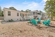 316 NE 52nd Street, Oak Island, NC 28465 — 3-bedroom home in Tranquil Harbor, Oak Island, NC, photo 2 of 49: 2_front exterior