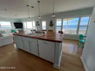 801 Ocean Drive, Emerald Isle, NC 28594 — 4-bedroom waterfront home, Emerald Isle, NC, photo 13 of 32: 13 Kitchen with custom island and VI