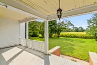 1323 Northside Road, Elizabeth City, NC 27909 — 4-bedroom home, Elizabeth City, NC, photo 21 of 72: Side Porch