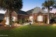 7568 Dunbar Drive SW, Sunset Beach, NC 28468 — 3-bedroom waterfront home in Sandpiper Bay, Sunset Beach, NC, photo 1 of 51: 7568 Dunbar