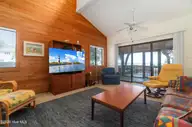 142 Lagoon Lane, Pine Knoll Shores, NC 28512 — 3-bedroom waterfront condo in Mcginnis Point, Pine Knoll Shores, NC, photo 21 of 41: Living Room
