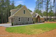 128 Banbridge Drive, Seven Lakes, NC 27376 — 4-bedroom home in Seven Lakes West, Seven Lakes, NC, photo 4 of 49: Side garage