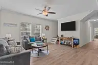 101 SW 28th Street, Oak Island, NC 28465 — 5-bedroom home in Pinners Point, Oak Island, NC, photo 9 of 56: Living Room
