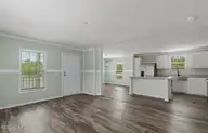 6823 Lewis Drive SE, Winnabow, NC 28479 — 3-bedroom manufactured home in Lewis Acres, Winnabow, NC, photo 5 of 21: Living room