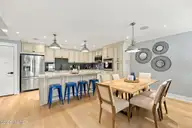 855 Salter Path Road 115, Indian Beach, NC 28512 — 2-bedroom waterfront condo in Colony By The Sea, Indian Beach, NC, photo 3 of 26: Dining to kitchen