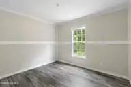 6777 Lewis Drive SE, Winnabow, NC 28479 — 3-bedroom manufactured home in Lewis Acres, Winnabow, NC, photo 19 of 22: Guest bedroom