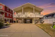 2004 W Beach Drive, Oak Island, NC 28465 — 4-bedroom waterfront home, Oak Island, NC, photo 1 of 54: 2004_W_Beach_Dr_Oak_Island_NC_tw2
