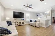 135 NE 75th Street, Oak Island, NC 28465 — 4-bedroom home in Tranquil Harbor, Oak Island, NC, photo 10 of 37: Living Room