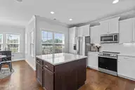 6112 Seagrove Court, Wilmington, NC 28412 — 4-bedroom home in Willow Glen, Wilmington, NC, photo 9 of 32: Kitchen island