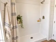 1580 Breezeway Drive SW, Ocean Isle Beach, NC 28469 — 2-bedroom home in Ocean Aire Estates, Ocean Isle Beach, NC, photo 19 of 19: Staged Bathroom Shower