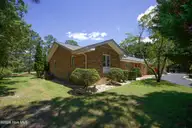 6 Pine Tree Terrace, Jackson Springs, NC 27281 — 4-bedroom home in Foxfire Village, Jackson Springs, NC, photo 22 of 29: L Side
