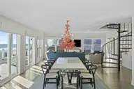 7313 Ocean Drive, Emerald Isle, NC 28594 — 5-bedroom waterfront home in Oakland Hills, Emerald Isle, NC, photo 12 of 66: Dining to Living Area