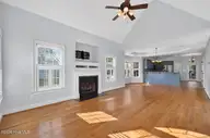 53 Westcliff Court, Clayton, NC 27527 — 5-bedroom home in The Knolls at the Neuse, Clayton, NC, photo 4 of 33: Cozy fireplace anchors the living room