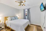426 Trott Street, Oak Island, NC 28465 — 3-bedroom home in Yaupon Beach, Oak Island, NC, photo 11 of 27: Guest bed